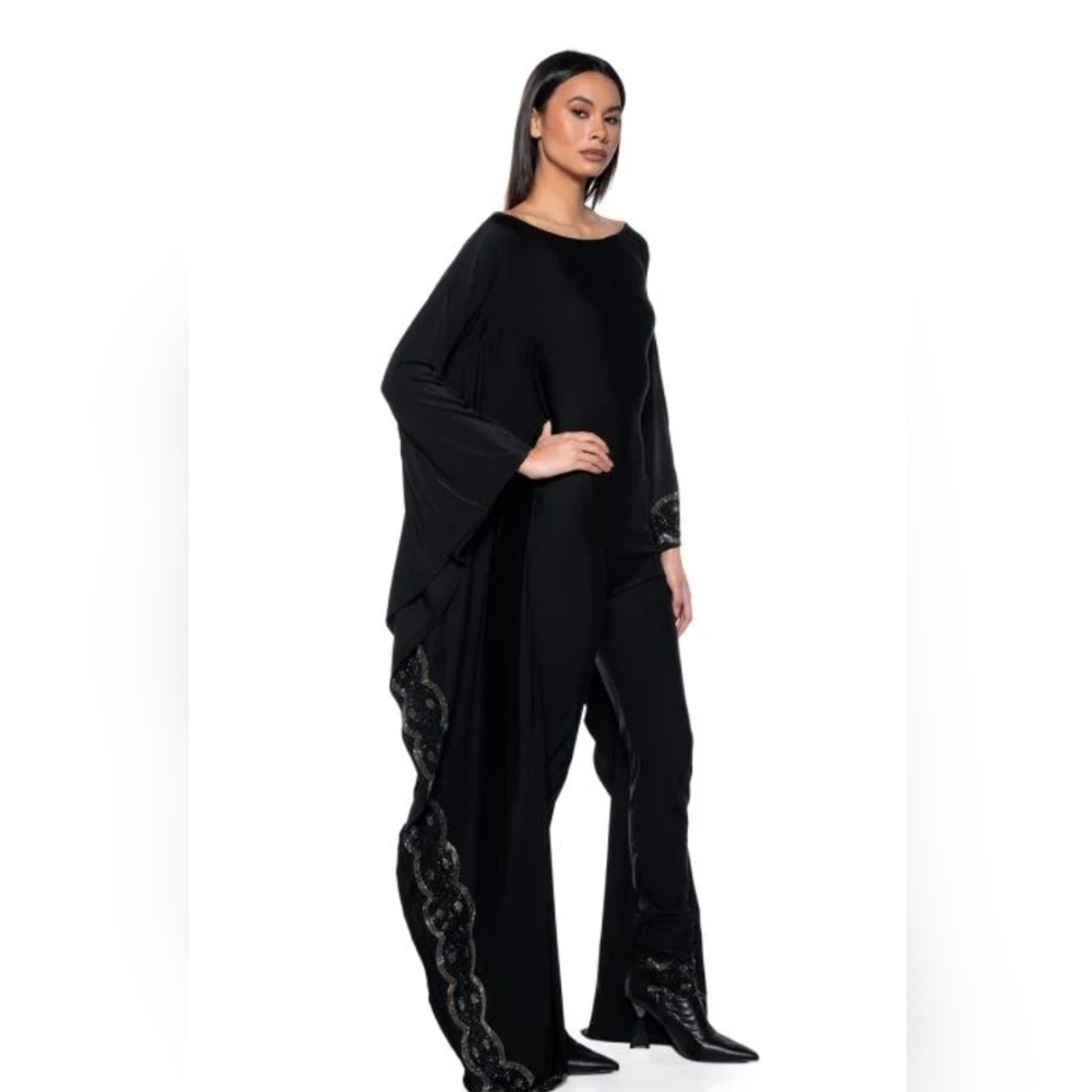 Ornate spandex jumpsuit with rhinestone details.